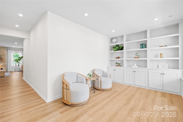 3110 Streamside Dr, Davidson, NC 28036 - sitting room with light wood-style flooring, recessed lighting, baseboards, and built in shelves
