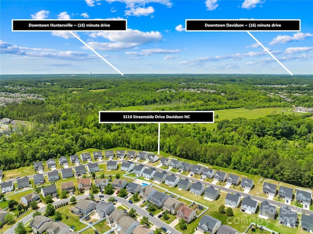 3110 Streamside Dr, Davidson, NC 28036 - aerial perspective of suburban area featuring a forest
