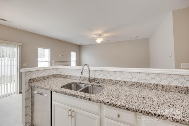 2169 Shady Pond Dr, Clover, SC 29710 - kitchen featuring a sink, ceiling fan, white cabinets, and light stone counters