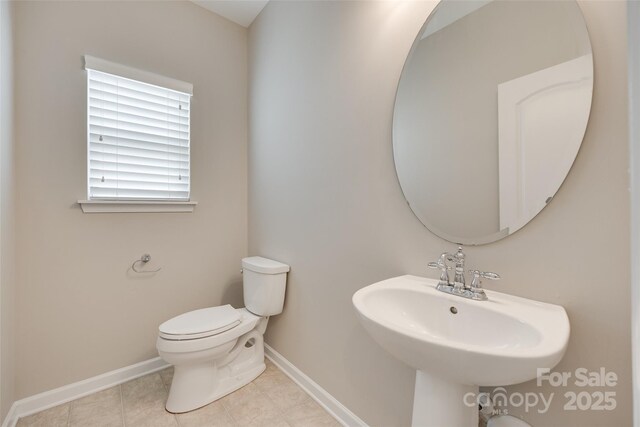 2169 Shady Pond Dr, Clover, SC 29710 - bathroom featuring baseboards, toilet, tile patterned flooring, and a sink