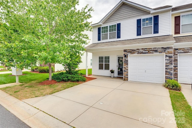 2169 Shady Pond Dr, Clover, SC 29710 - view of front of home with an attached garage, driveway, a front yard, and stone siding