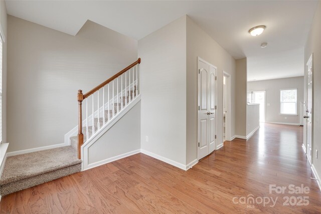 2169 Shady Pond Dr, Clover, SC 29710 - entryway with light wood finished floors, stairs, and baseboards