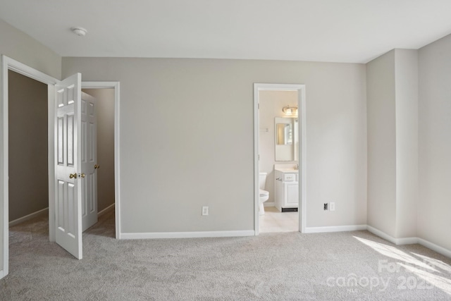 6332 Sackett Way, Charlotte, NC 28269 - unfurnished bedroom with light colored carpet, baseboards, and ensuite bathroom