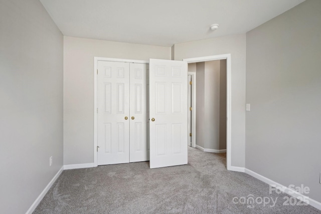 6332 Sackett Way, Charlotte, NC 28269 - unfurnished bedroom with carpet flooring, baseboards, and a closet