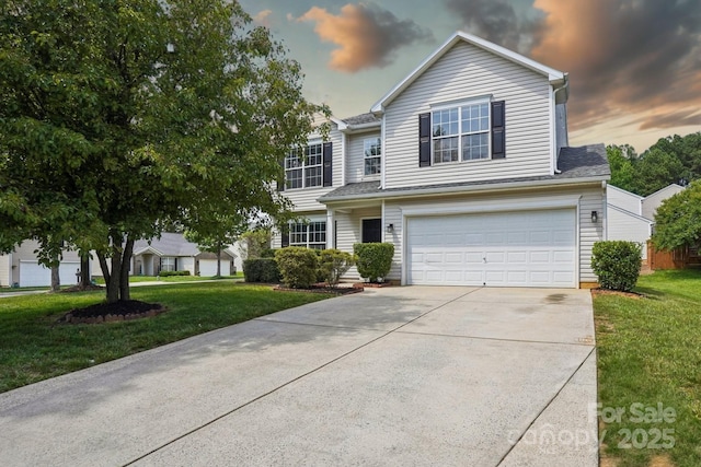 6332 Sackett Way, Charlotte, NC 28269 - traditional home with a garage, driveway, and a front lawn