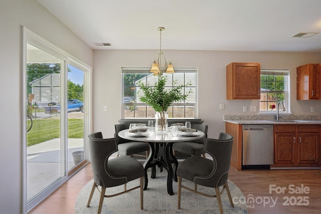 6332 Sackett Way, Charlotte, NC 28269 - dining area with light wood-style flooring and plenty of natural light