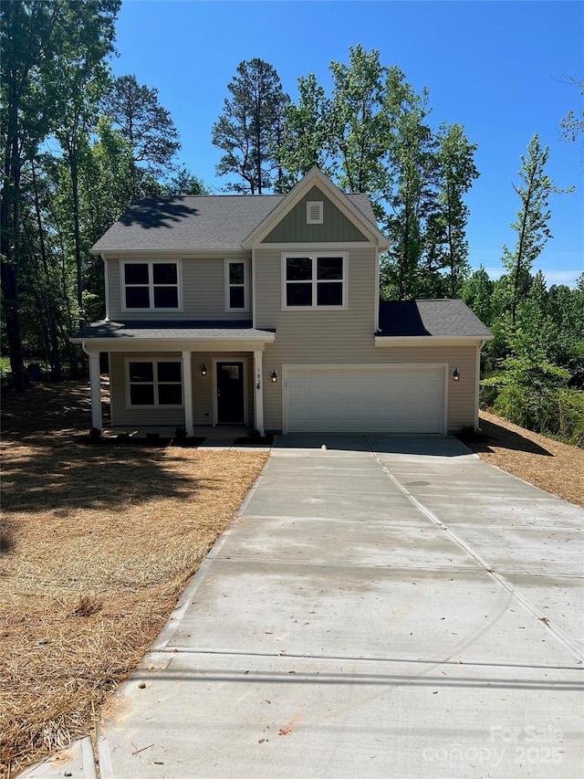 183 Pine Haven Rd, Statesville, NC 28677 - view of front of property featuring concrete driveway, board and batten siding, and a garage