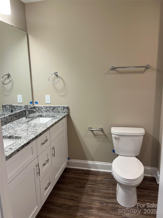 183 Pine Haven Rd, Statesville, NC 28677 - bathroom with baseboards, toilet, wood finished floors, and double vanity