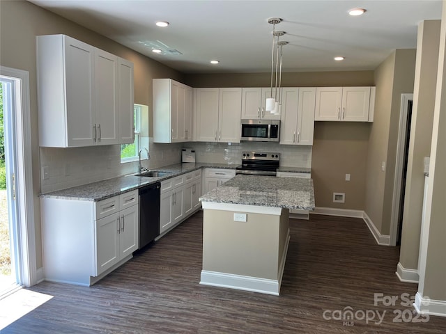 183 Pine Haven Rd, Statesville, NC 28677 - kitchen with stainless steel appliances, a sink, plenty of natural light, white cabinets, and recessed lighting