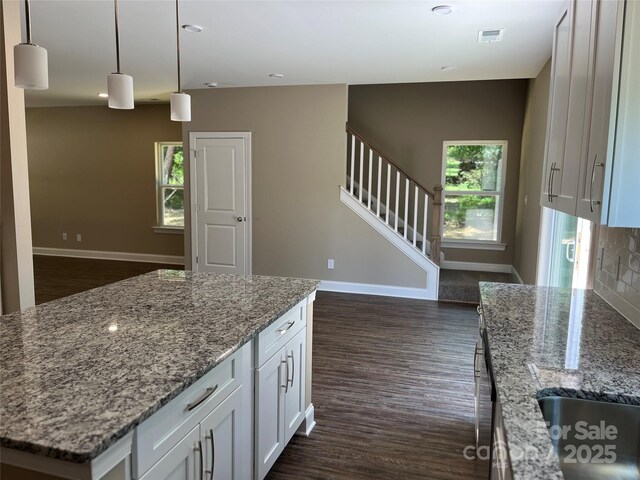 183 Pine Haven Rd, Statesville, NC 28677 - kitchen featuring dark wood-style floors, baseboards, white cabinetry, and light stone counters