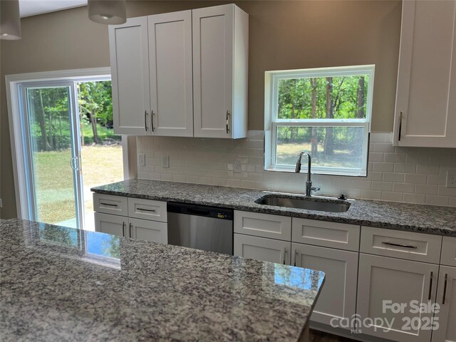 183 Pine Haven Rd, Statesville, NC 28677 - kitchen with dishwasher, a sink, white cabinets, and light stone countertops