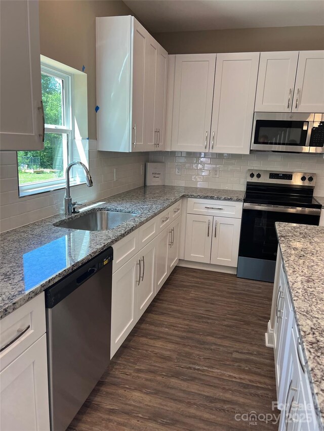 183 Pine Haven Rd, Statesville, NC 28677 - kitchen featuring stainless steel appliances, a sink, white cabinets, and tasteful backsplash