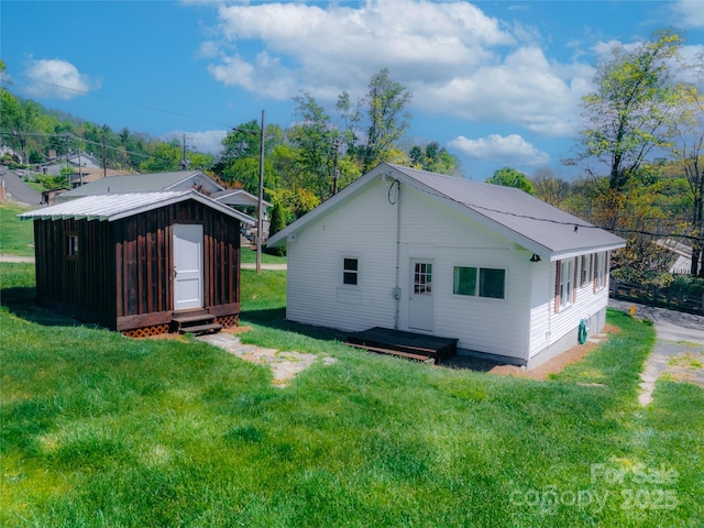 35 Amethyst St, Spruce Pine, NC 28777 - back of house with a yard and an outbuilding