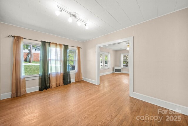 35 Amethyst St, Spruce Pine, NC 28777 - empty room with light wood-style flooring, baseboards, and plenty of natural light