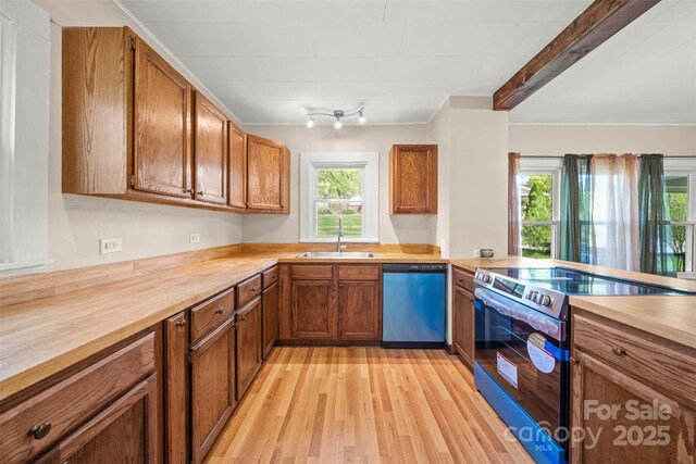 35 Amethyst St, Spruce Pine, NC 28777 - kitchen featuring dishwasher, stainless steel range with electric cooktop, a sink, light wood finished floors, and brown cabinetry