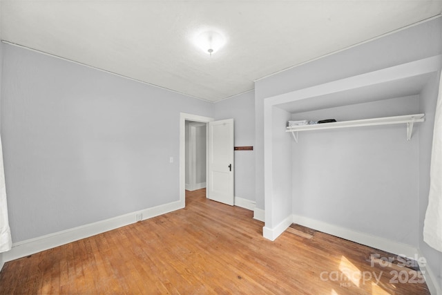 35 Amethyst St, Spruce Pine, NC 28777 - unfurnished bedroom featuring a closet, baseboards, and light wood-type flooring