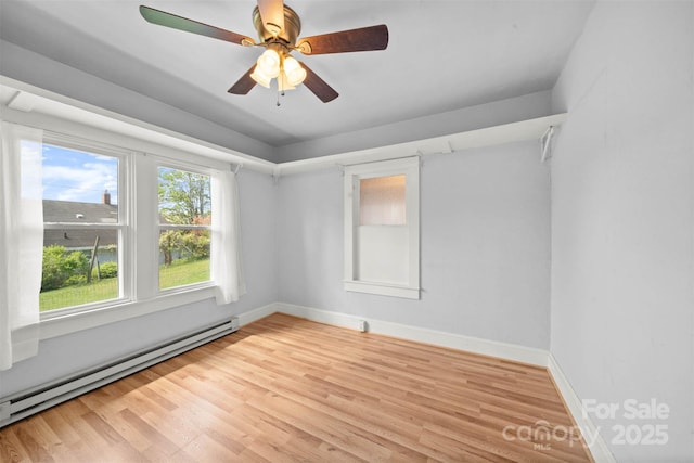 35 Amethyst St, Spruce Pine, NC 28777 - spare room with baseboard heating, light wood-style floors, baseboards, and ceiling fan