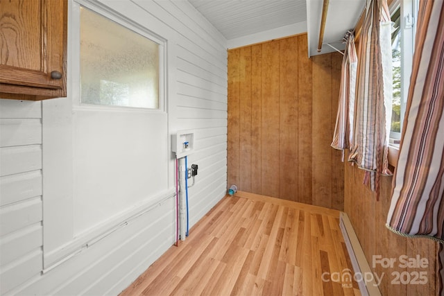 35 Amethyst St, Spruce Pine, NC 28777 - washroom featuring light wood-style flooring, wooden walls, a baseboard heating unit, washer hookup, and baseboards