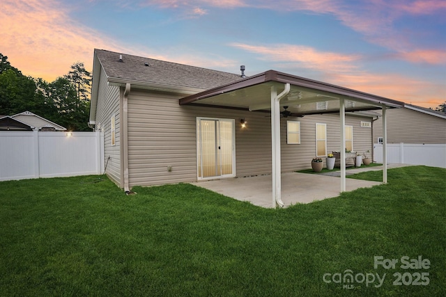 2021 Chantilly Ln, Salisbury, NC 28146 - back of house at dusk with a ceiling fan, a patio, and roof with shingles