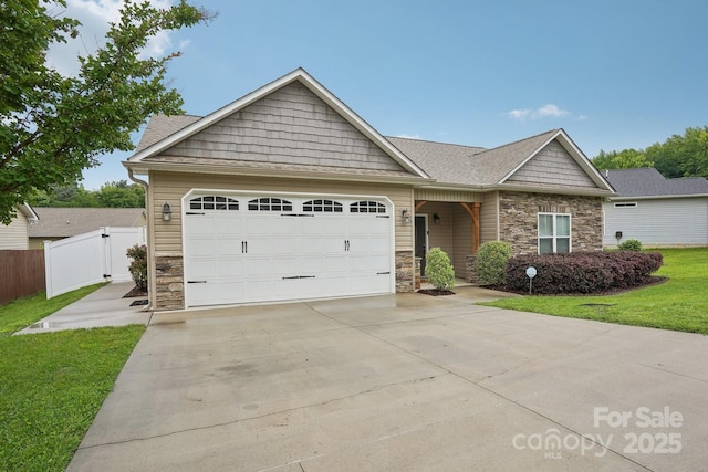 2021 Chantilly Ln, Salisbury, NC 28146 - craftsman-style home featuring stone siding, an attached garage, and concrete driveway