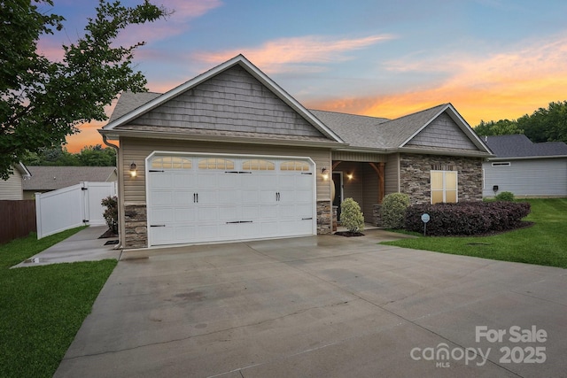 2021 Chantilly Ln, Salisbury, NC 28146 - view of front of house with stone siding, driveway, and a garage