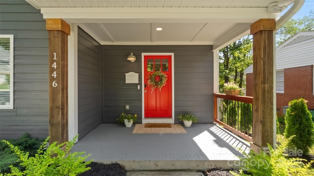 1446 Downs Ave, Charlotte, NC 28205 - doorway to property with a porch