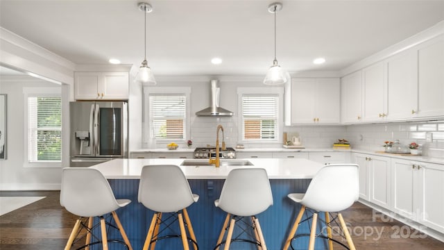 1446 Downs Ave, Charlotte, NC 28205 - kitchen featuring wall chimney exhaust hood, stainless steel fridge, decorative backsplash, plenty of natural light, and recessed lighting