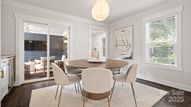 1446 Downs Ave, Charlotte, NC 28205 - dining space featuring dark wood finished floors, crown molding, and a chandelier