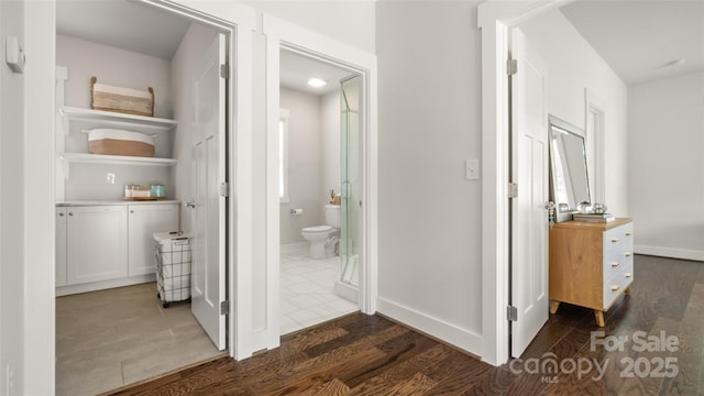 1446 Downs Ave, Charlotte, NC 28205 - hallway with dark wood-style flooring and baseboards