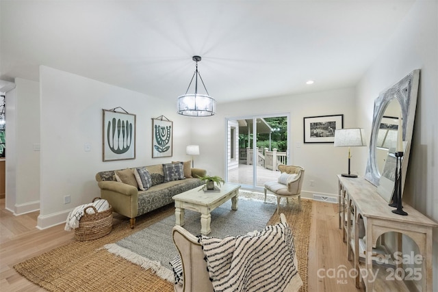 9520 Squirrel Hollow Ln, Charlotte, NC 28270 - living area featuring a chandelier, light wood-type flooring, baseboards, and recessed lighting
