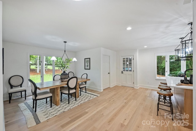9520 Squirrel Hollow Ln, Charlotte, NC 28270 - dining space featuring baseboards, healthy amount of natural light, light wood-style flooring, recessed lighting, and a chandelier