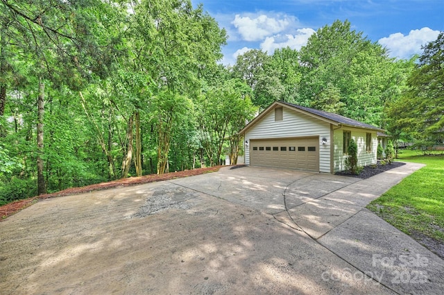 9520 Squirrel Hollow Ln, Charlotte, NC 28270 - view of home's exterior with a garage and concrete driveway
