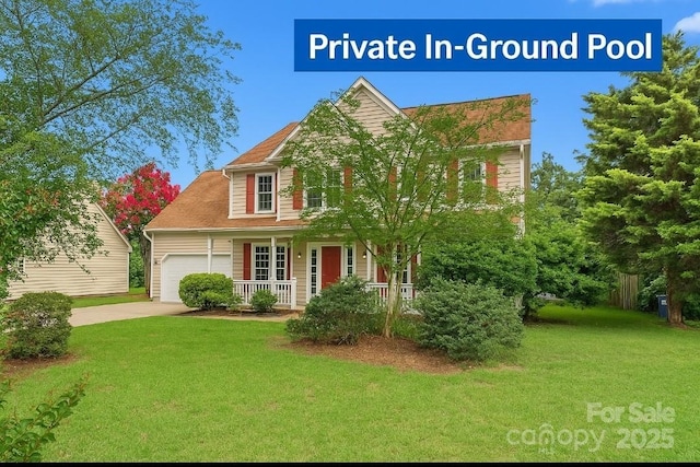 6614 Truman St, Indian Trail, NC 28079 - traditional-style home featuring covered porch, driveway, and a garage