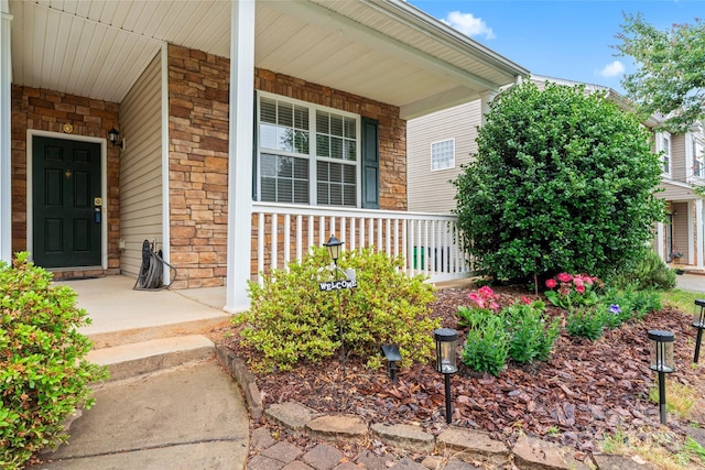 1911 Savannah Hills Dr, Matthews, NC 28105 - view of exterior entry with a porch and stone siding