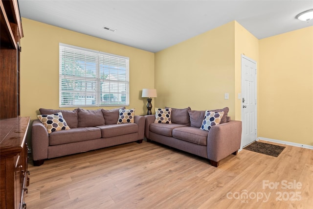 1911 Savannah Hills Dr, Matthews, NC 28105 - living area with light wood-type flooring and baseboards