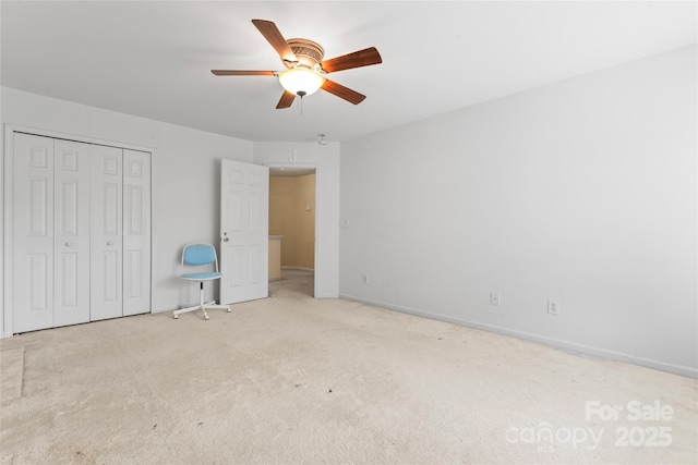 1911 Savannah Hills Dr, Matthews, NC 28105 - unfurnished bedroom with carpet flooring, a closet, a ceiling fan, and baseboards