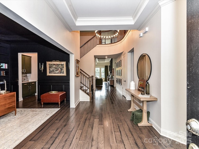 121 Enclave Meadows Ln, Matthews, NC 28104 - entrance foyer featuring stairway, a chandelier, crown molding, wood finished floors, and a high ceiling