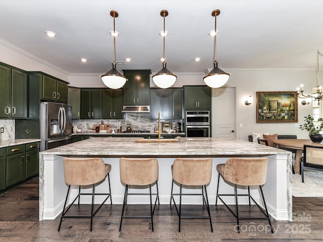 121 Enclave Meadows Ln, Matthews, NC 28104 - kitchen featuring appliances with stainless steel finishes, green cabinetry, a sink, ornamental molding, and backsplash