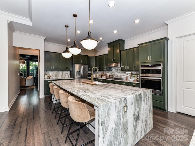 121 Enclave Meadows Ln, Matthews, NC 28104 - kitchen featuring stainless steel appliances, ornamental molding, a sink, tasteful backsplash, and light stone counters