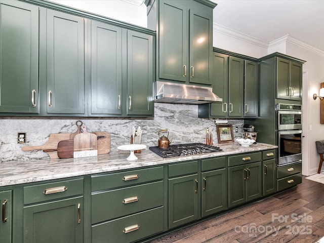 121 Enclave Meadows Ln, Matthews, NC 28104 - kitchen with green cabinets, appliances with stainless steel finishes, under cabinet range hood, crown molding, and dark wood-style floors