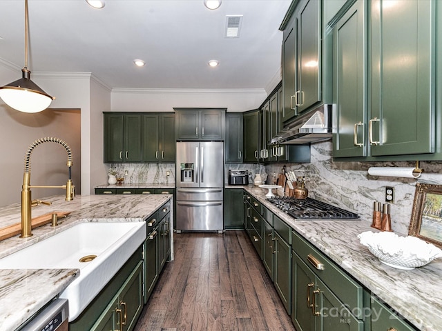 121 Enclave Meadows Ln, Matthews, NC 28104 - kitchen featuring stainless steel appliances, green cabinets, a sink, ornamental molding, and recessed lighting