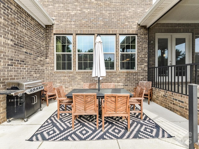 121 Enclave Meadows Ln, Matthews, NC 28104 - view of patio featuring a grill and outdoor dining space