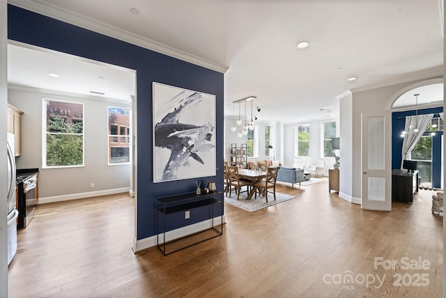229 N Church St Unit 204, Charlotte, NC 28202 - hall featuring light wood-type flooring, healthy amount of natural light, ornamental molding, baseboards, and recessed lighting