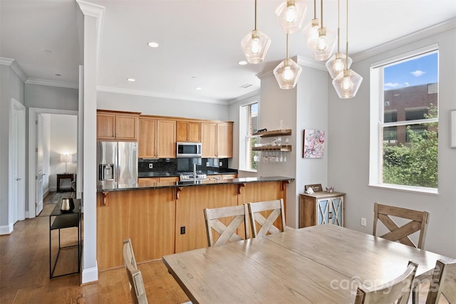229 N Church St Unit 204, Charlotte, NC 28202 - dining space with light wood-style floors, plenty of natural light, crown molding, and recessed lighting