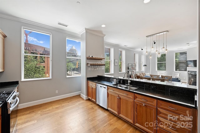 229 N Church St Unit 204, Charlotte, NC 28202 - kitchen with appliances with stainless steel finishes, a sink, crown molding, plenty of natural light, and baseboards