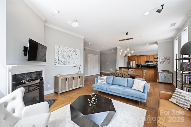 229 N Church St Unit 204, Charlotte, NC 28202 - living area featuring ornamental molding, recessed lighting, wood finished floors, a fireplace, and baseboards