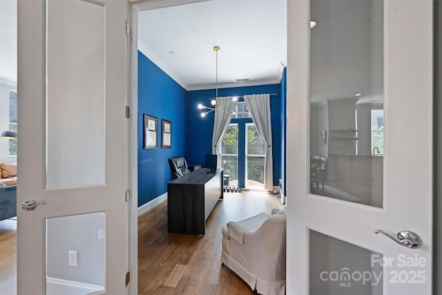 229 N Church St Unit 204, Charlotte, NC 28202 - office space featuring wood finished floors, crown molding, baseboards, and a chandelier