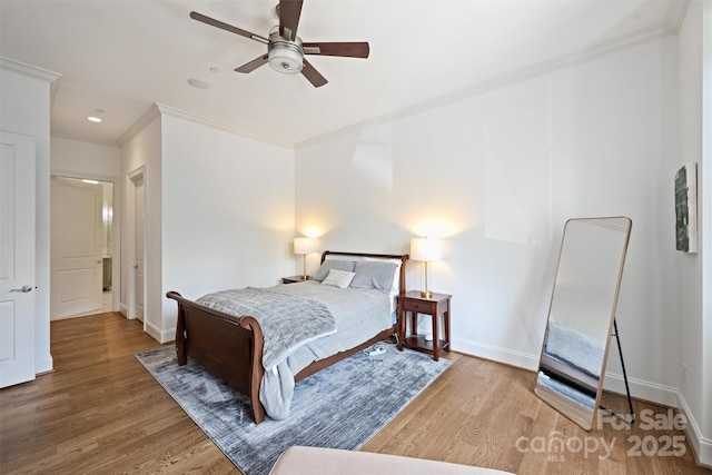 229 N Church St Unit 204, Charlotte, NC 28202 - bedroom featuring baseboards, wood finished floors, ornamental molding, and a ceiling fan