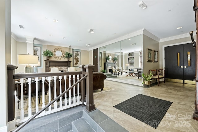 229 N Church St Unit 204, Charlotte, NC 28202 - reception with crown molding, recessed lighting, and a fireplace