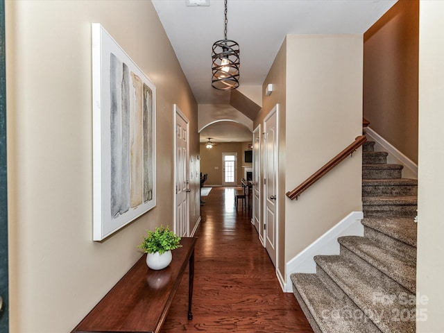 7325 Overmountain Dr, Rock Hill, SC 29732 - hallway featuring stairway, dark wood-style flooring, baseboards, and arched walkways